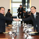 Head of the North Korean delegation Ri Son-gwon, left, shakes hands with his South Korean counterpart Cho Myoung-gyon at the start of talks Tuesday.